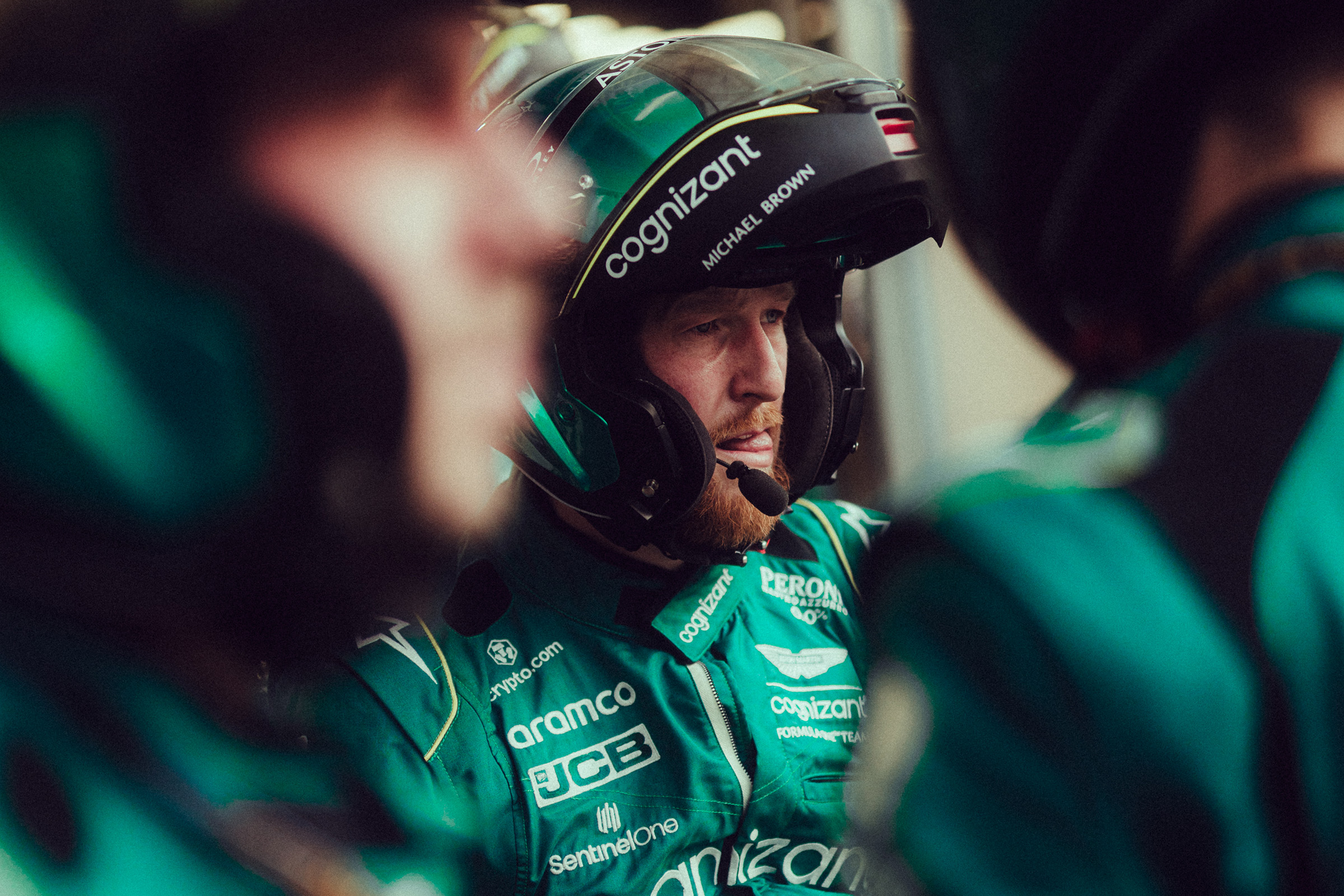 A driver in race suit in the garage