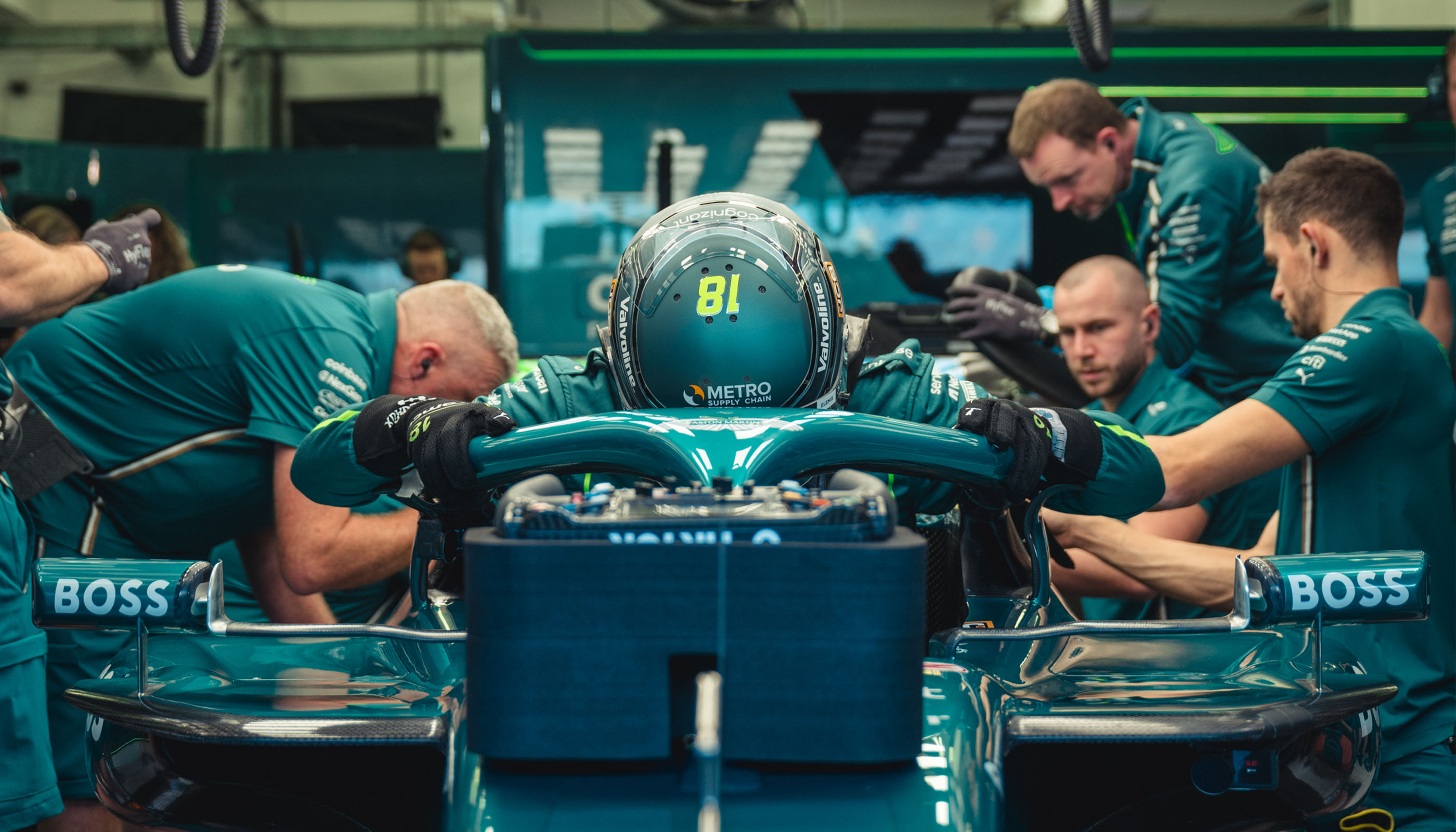 Mechanics preparing a Formula 1 car in the garage